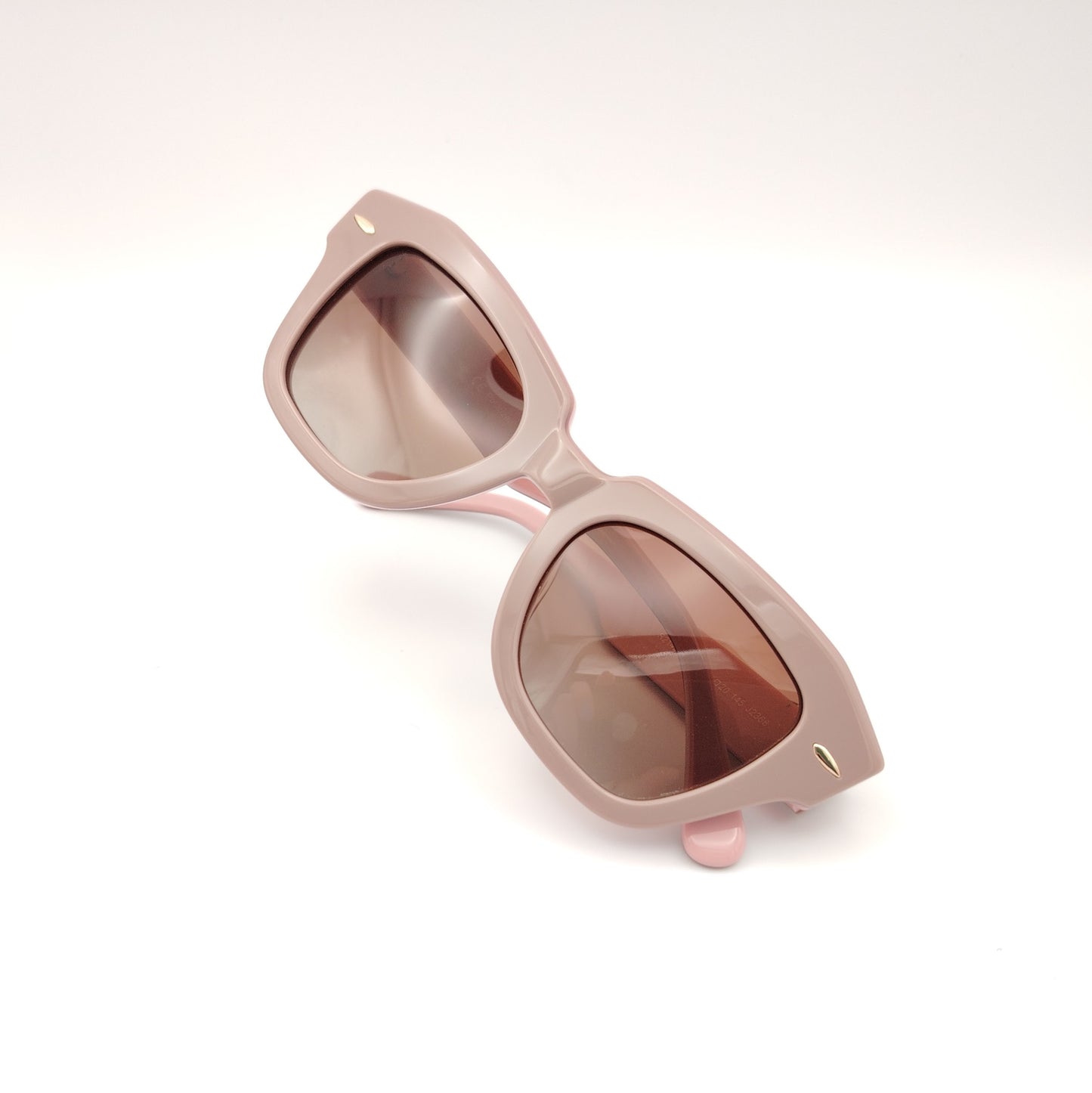 gafas de sol rischio r21423 c11 con montura geométrica en acetato rosa empolvado y lentes marrones degradadas, diseño elegante y femenino