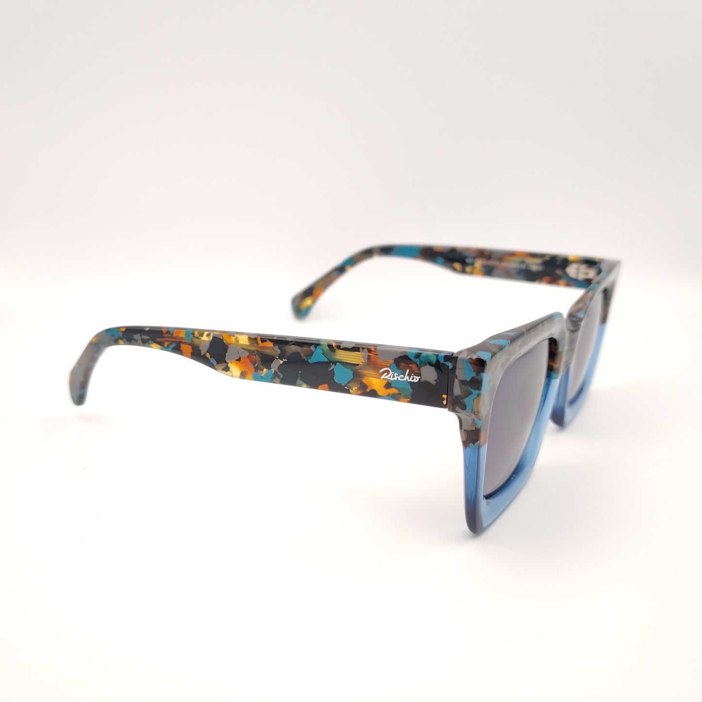 gafas de sol rischio r21428 c113 cuadradas de acetato azul con parte superior multicolor y lentes polarizada