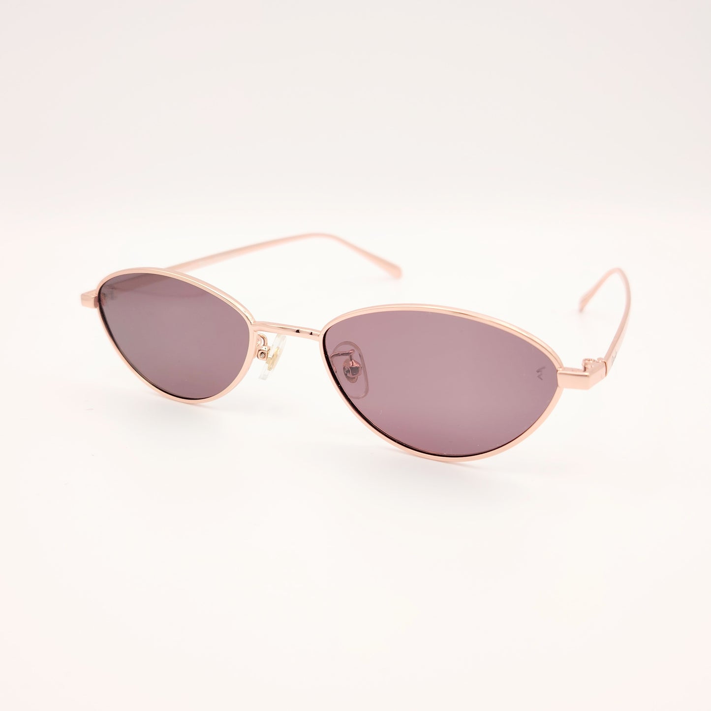 gafas de sol polarizadas rischio r21250 c14 con montura metálica oro rosado y lentes oscuras ovaladas