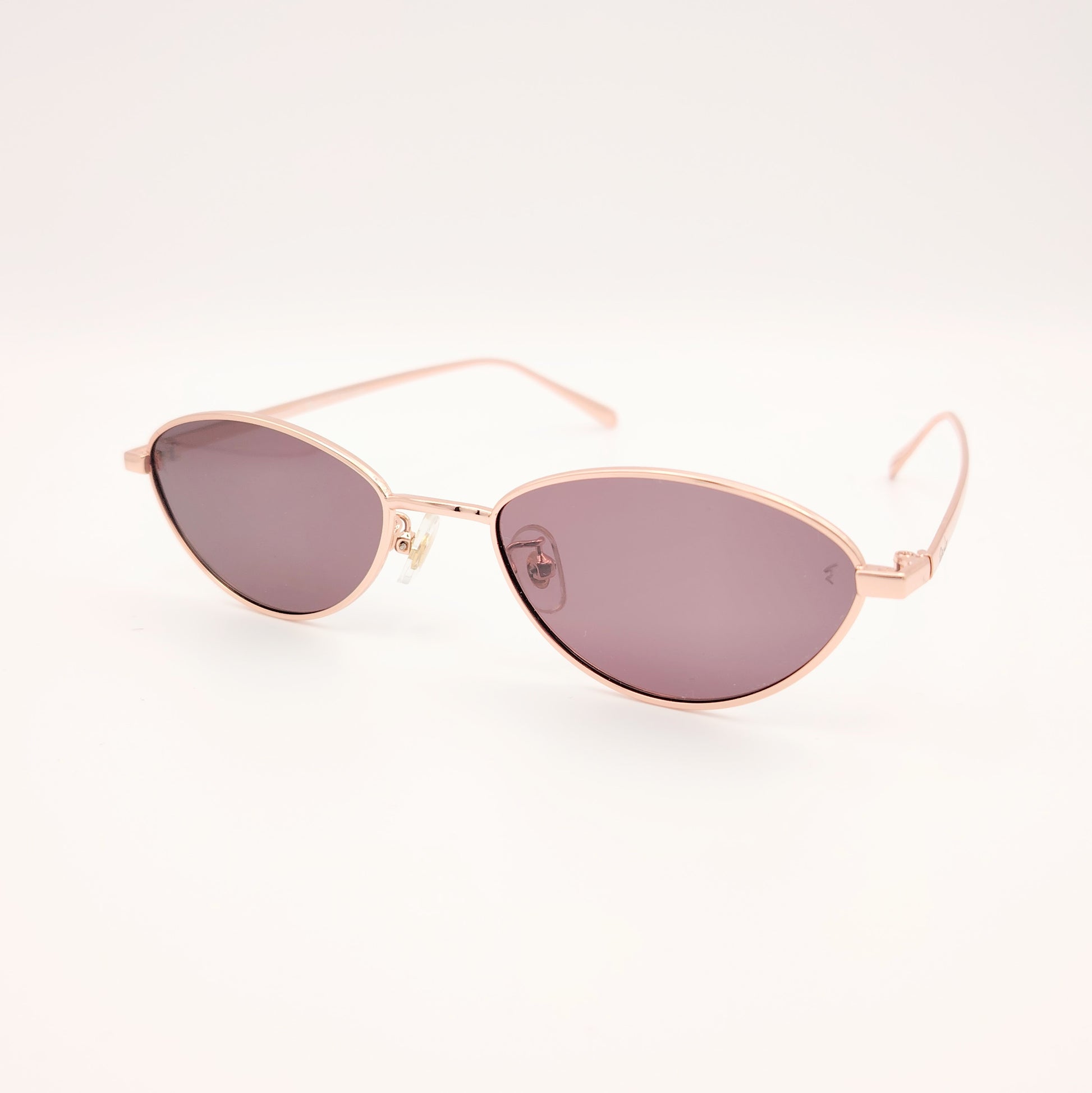 gafas de sol polarizadas rischio r21250 c14 con montura metálica oro rosado y lentes oscuras ovaladas