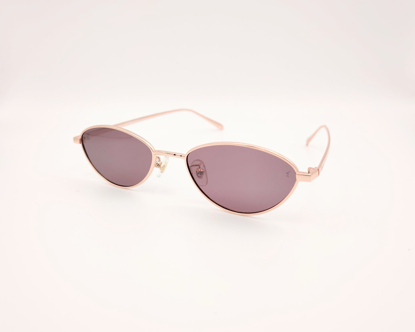gafas de sol polarizadas rischio r21250 c14 con montura metálica oro rosado y lentes oscuras ovaladas