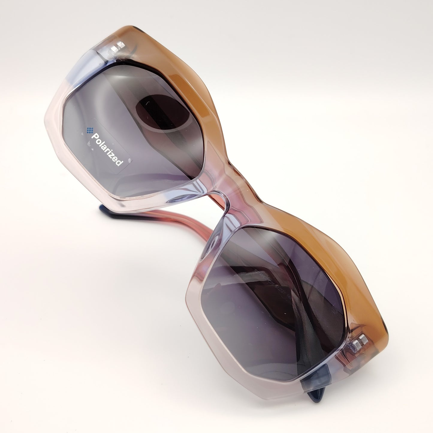 gafas de sol polarizadas rischio r21464 c08 con montura de pasta degradada en tonos marrón y malva, y lentes oscuras polarizadas